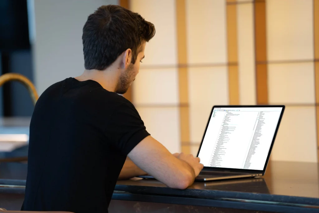 man using GoldenGate software on his laptop