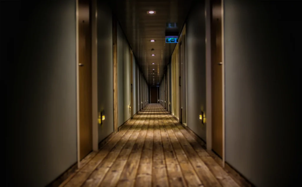 dimly lit hotel corridor